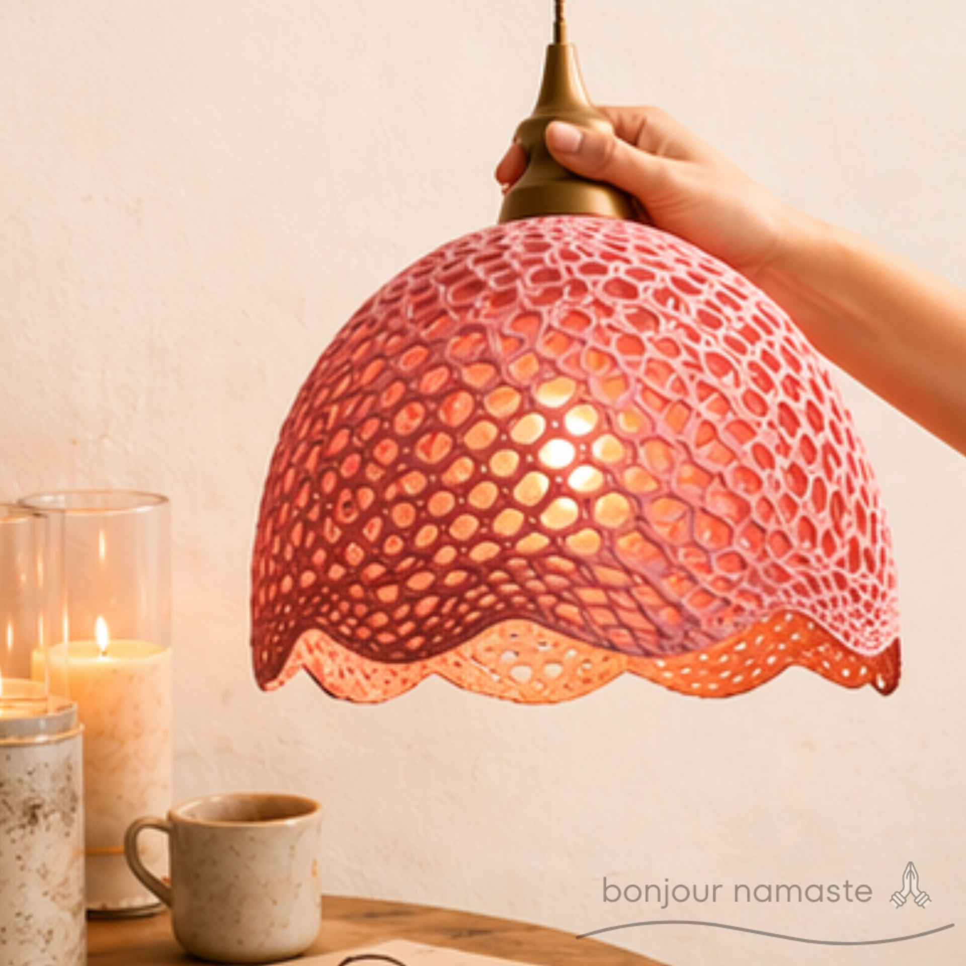 hand-crocheted lampshade held by customer over a display with cup and candle